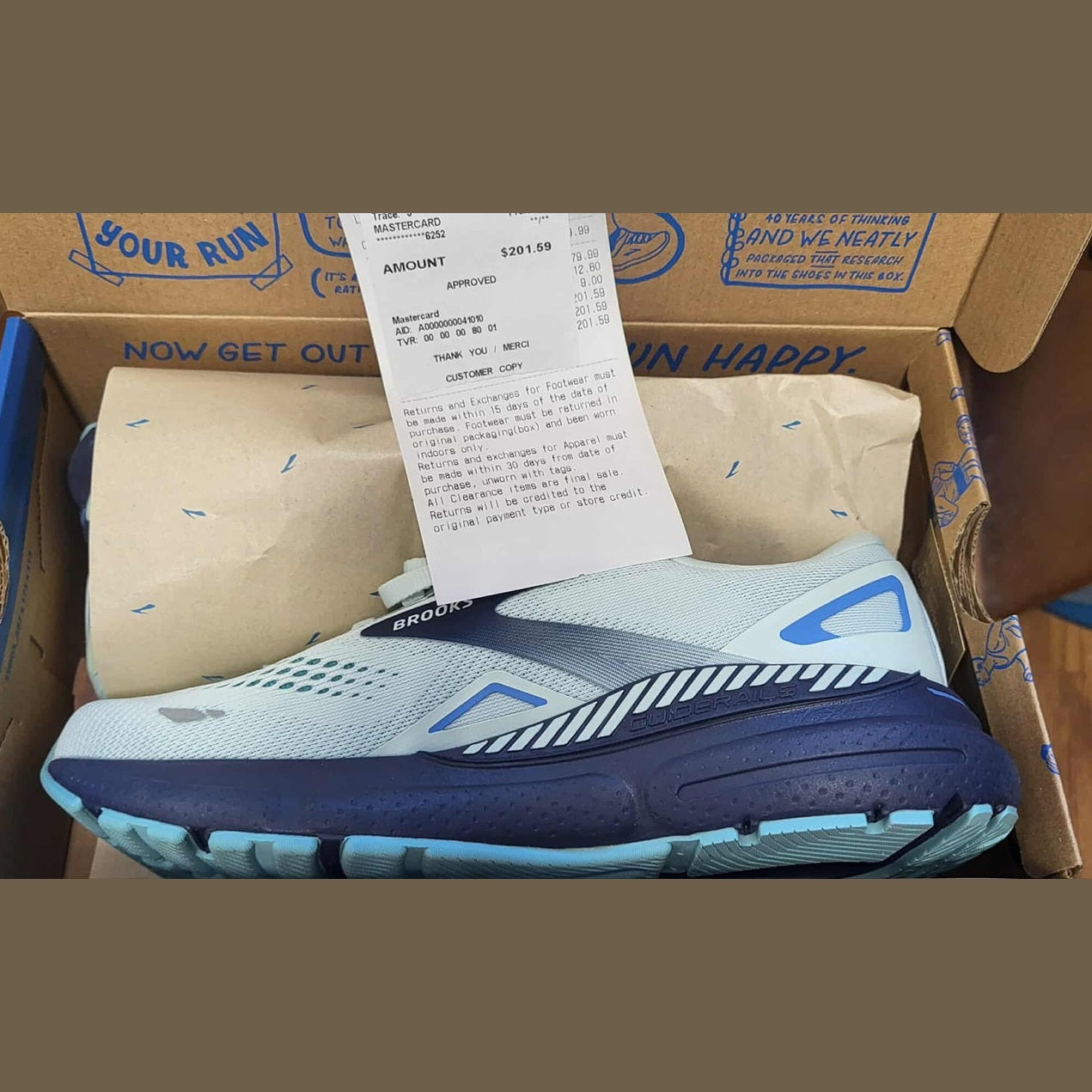 shoes in shoe box with receipt
