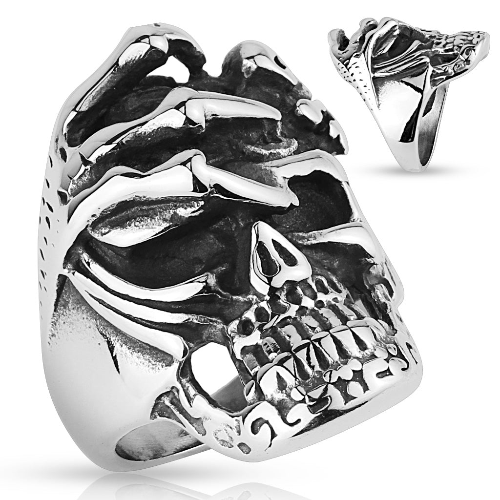 Skull with skeleton hand ring